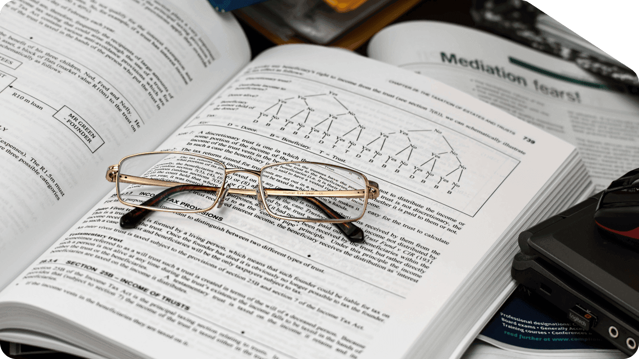 Book with magnifying glass